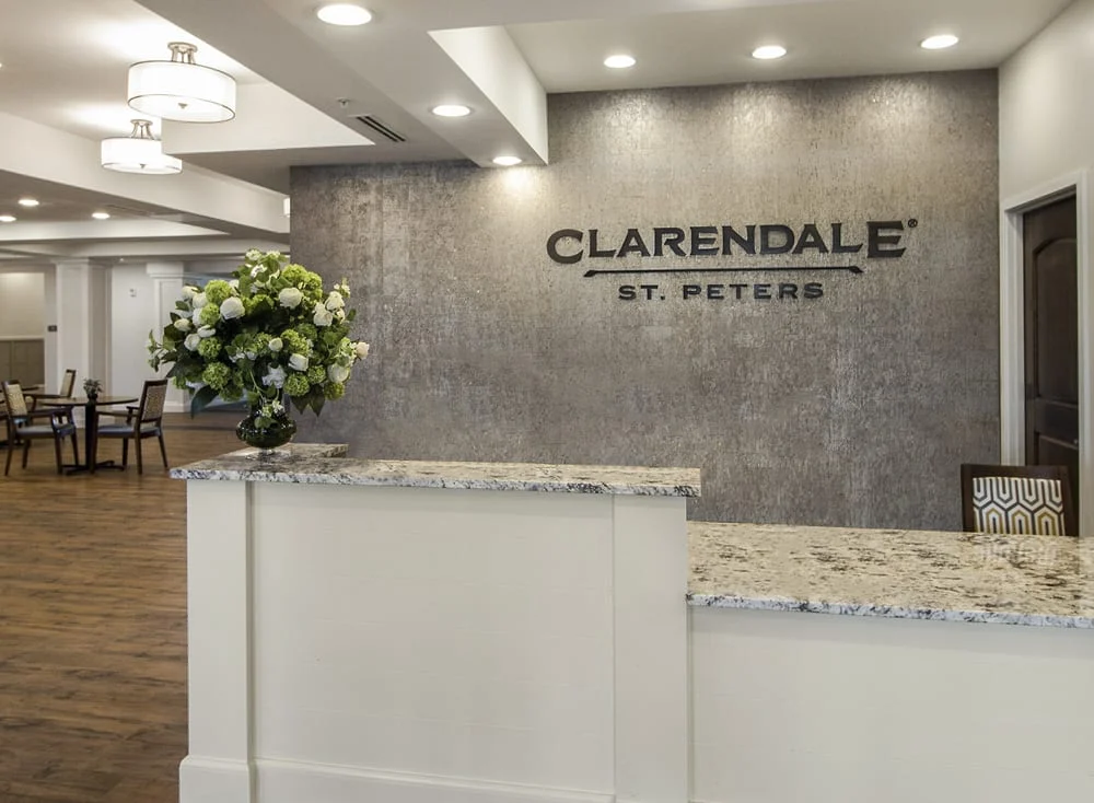custom dimensional logo in a senior living reception area