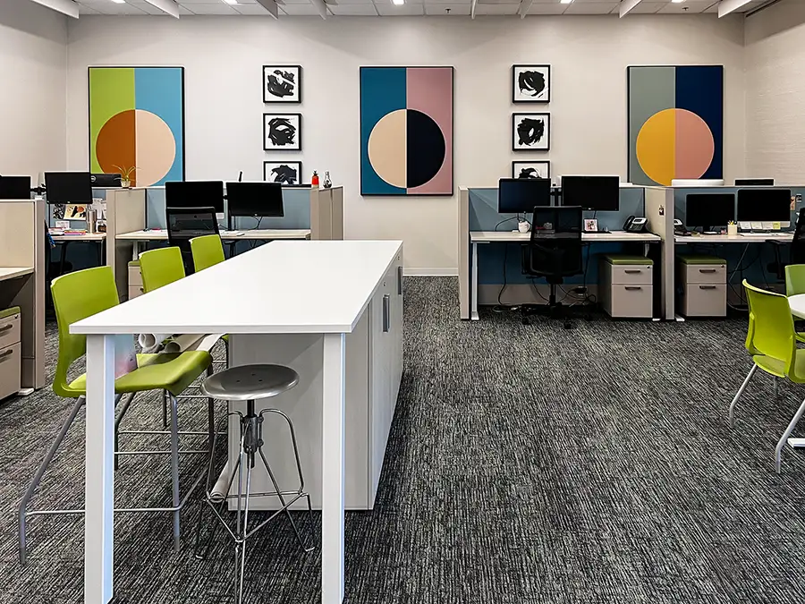 Custom sound-absorbing art helps minimize noise and improve concentration in shared office spaces with open floor plans.